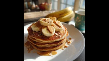 Banana pancake protein recipe with almond butter and banana slices