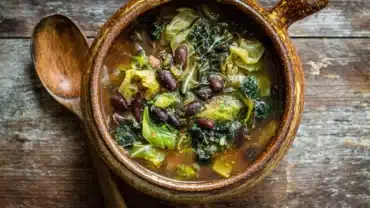 hearty black bean and cabbage soup in a rustic bowl
