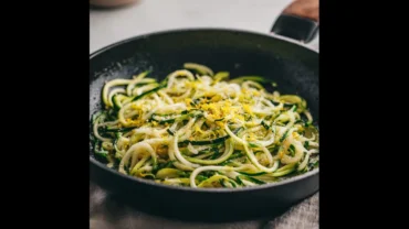 Featured image of frozen zucchini noodles sautéed with garlic and lemon