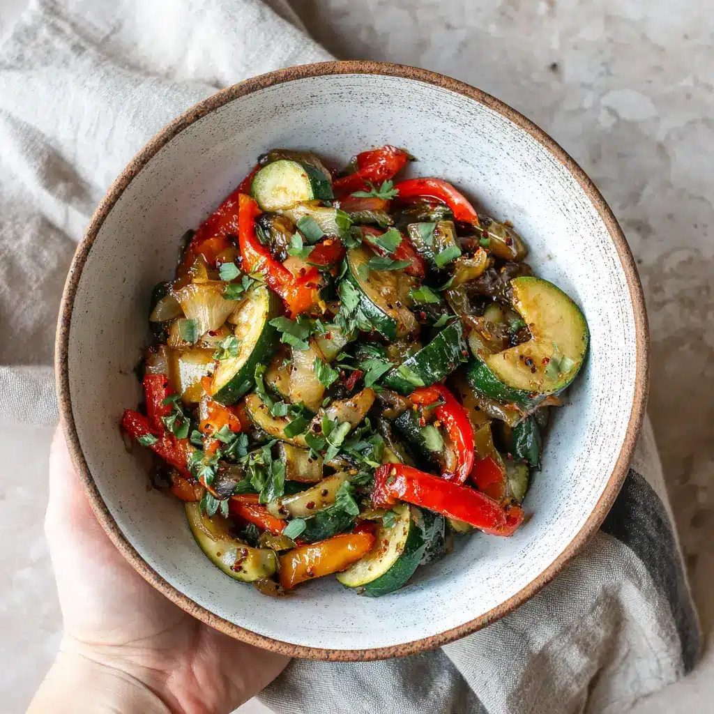 Zucchini Bell Pepper Recipe: 4 Refreshing Twists to Elevate Energy 5 Warm bowl of zucchini bell pepper stir fry held by hand