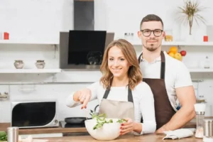 Siera, founder of DelishDose, standing in her kitchen smiling with confidence
